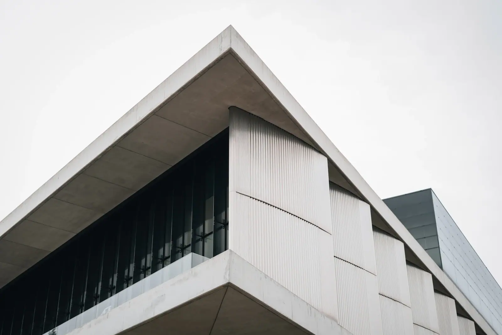 Angular concrete residence seen against a muted sky