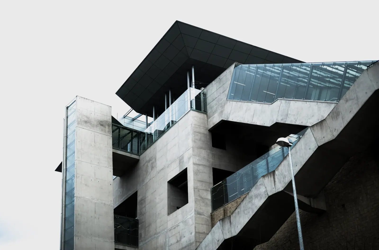 Contemporary concrete structure with an exterior glass stair