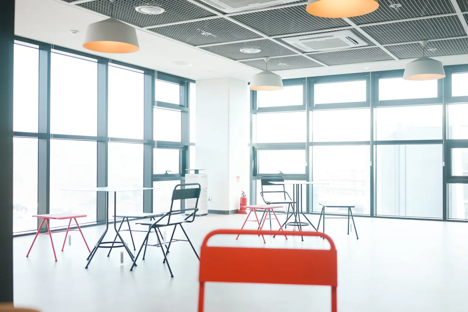 Bright modern interior with a precise ceiling grid